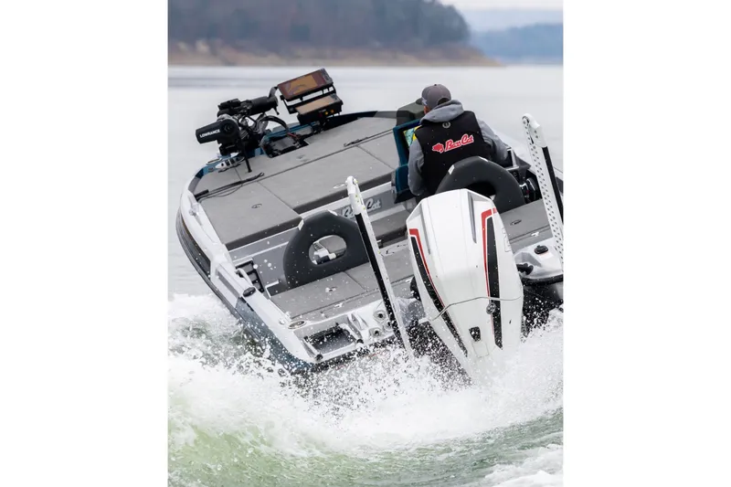 Slide: The Image of 2027 Bass Cat Pantera boat speeding on water, rear view with motor and fishing equipment. - 10