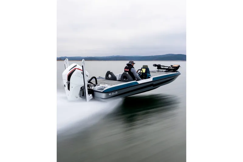 Slide: The Image of 2027 Bass Cat Pantera boat speeding on a lake with a powerful engine. - 12