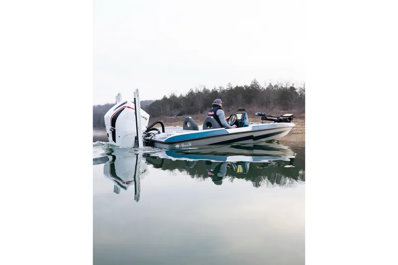 Slide: The Image of 2027 Bass Cat Pantera boat on calm water, featuring sleek design and powerful engine. - 3