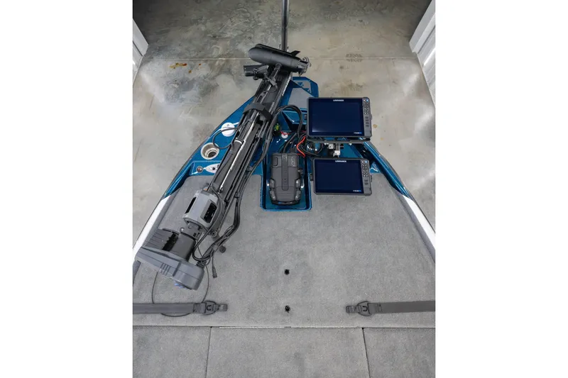 Slide: The Image of 2027 Bass Cat Pantera boat deck with advanced navigation screens and equipment. - 8