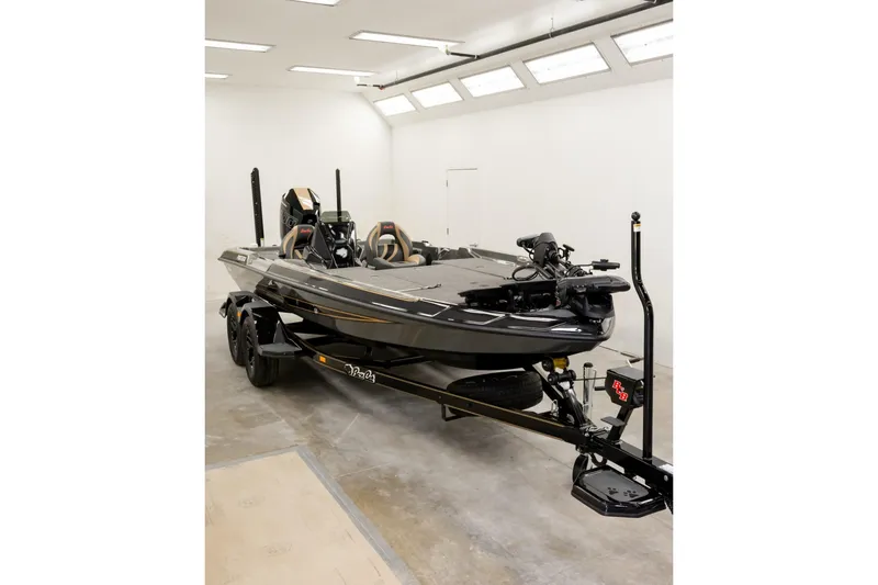 Slide: The Image of 2027 Bass Cat Pantera boat in a well-lit showroom, showcasing sleek design and modern features. - 9