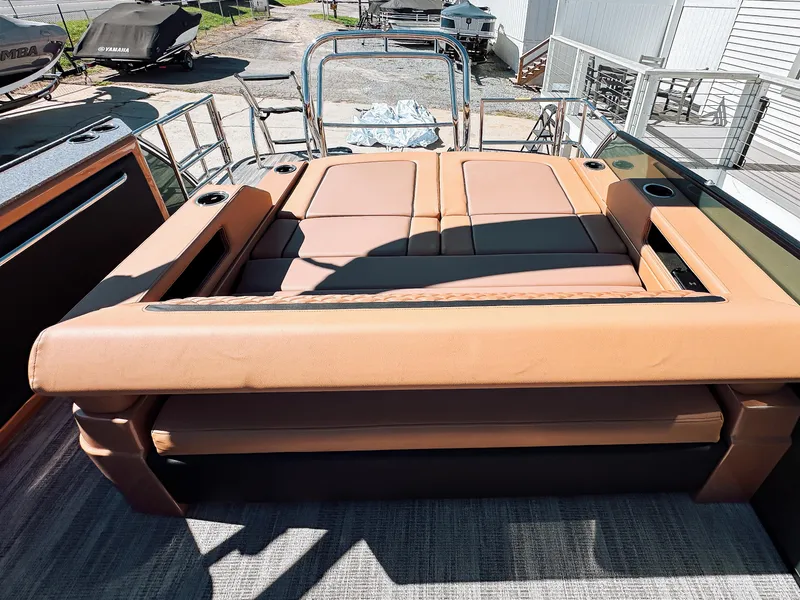 Slide: The Image of 2025 Godfrey AquaPatio 23' Flip Lounge Tritoon with luxurious tan seating. - 17