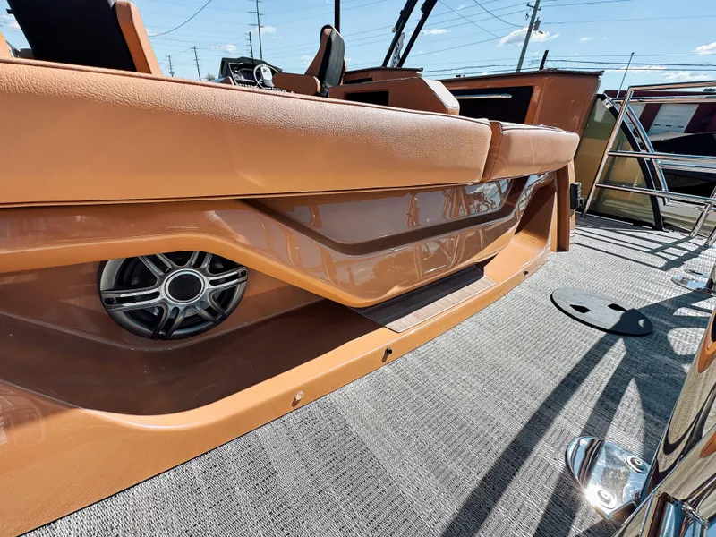 Slide: The Image of 2025 Godfrey AquaPatio 23' Tritoon with flip lounge, featuring sleek design and premium audio system. - 19