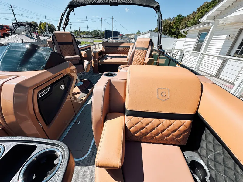 Slide: The Image of 2025 Godfrey AquaPatio 23' Flip Lounge Tritoon with luxurious tan seating and modern design. - 9
