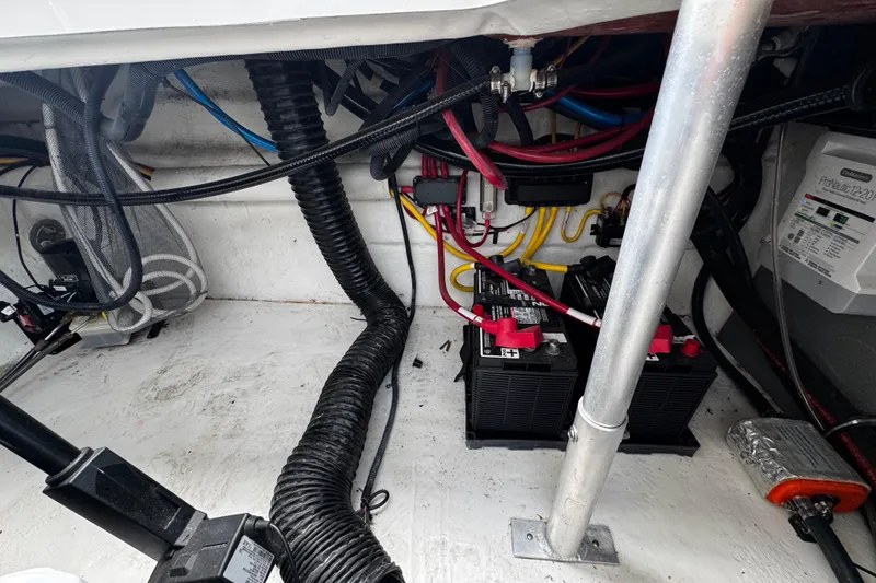 Slide: The Image of Electrical system of a 2022 Monterey 295 Sport Yacht, featuring batteries and wiring. - 22