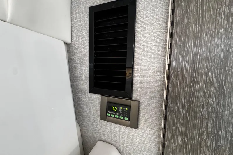 Slide: The Image of Climate control panel in 2022 Monterey 295 Sport Yacht interior. - 29
