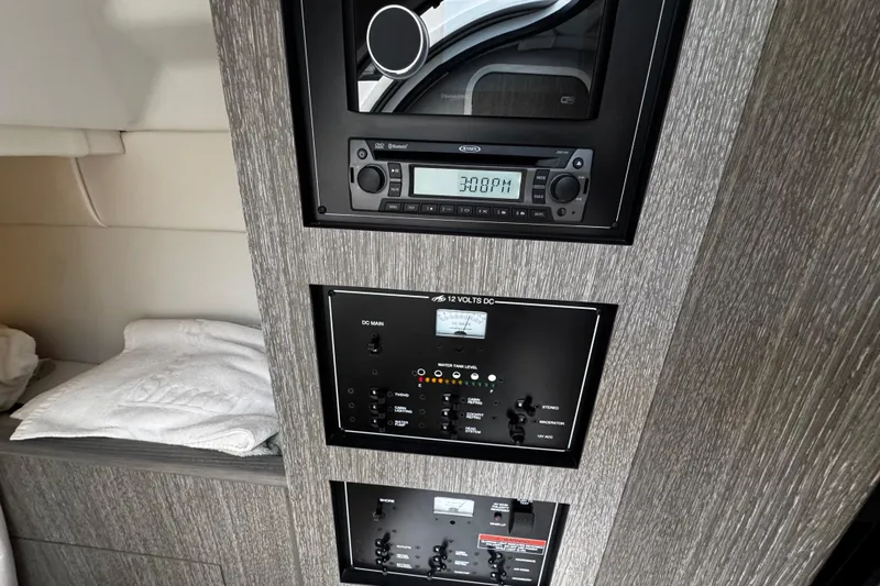 Slide: The Image of Control panel and stereo system inside 2022 Monterey 295 Sport Yacht cabin. - 30