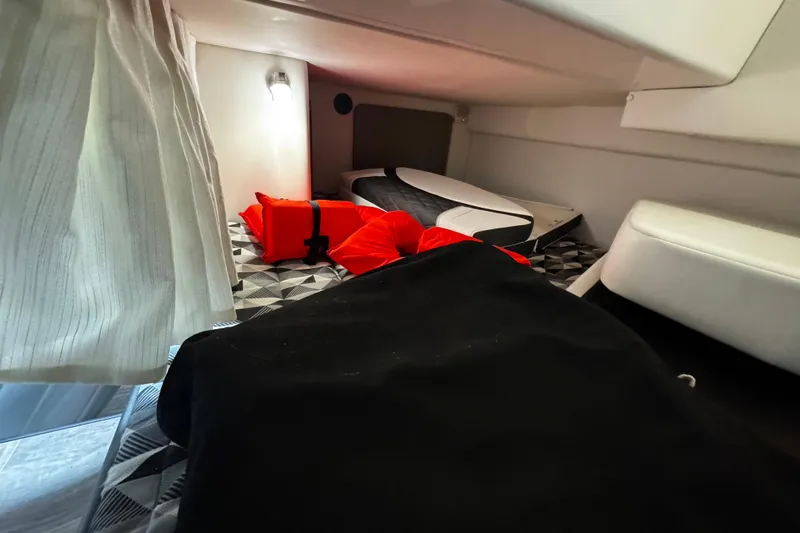 Slide: The Image of Interior cabin of 2022 Monterey 295 Sport Yacht with cushions and life jackets. - 31