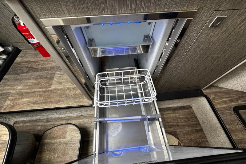 Slide: The Image of Open refrigerator drawer in 2022 Monterey 295 Sport Yacht interior. - 33
