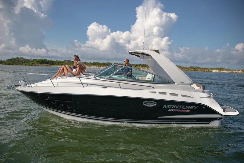The Image of Manufacturer Provided Image: 2022 Monterey 295SS Super Sport boat cruising on a sunny day with passengers onboard. - 0