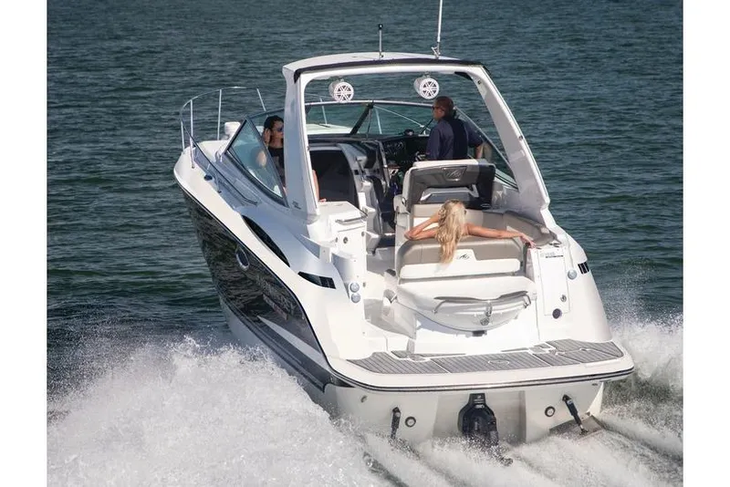 Slide: The Image of Manufacturer Provided Image: 2022 Monterey 295SS Super Sport boat cruising on water with passengers onboard. - 1