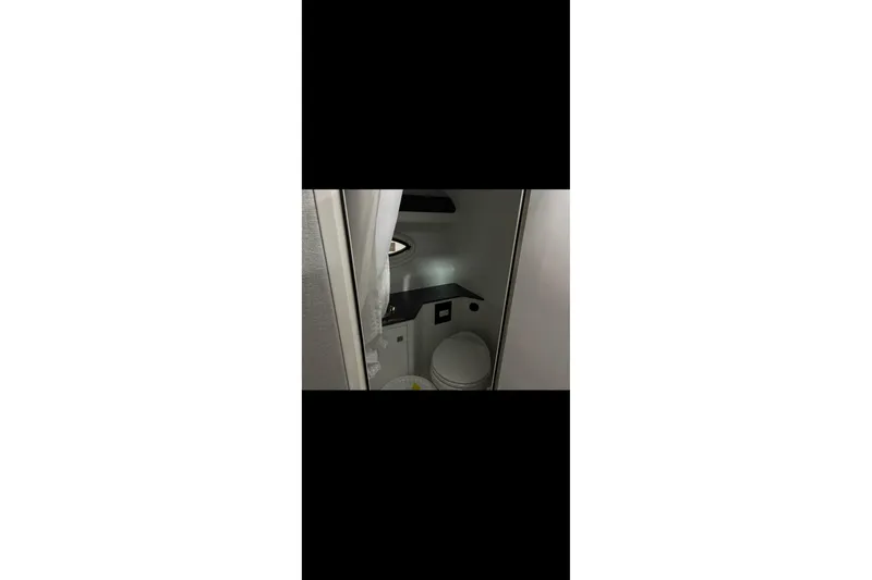 Slide: The Image of Interior of 2022 Monterey 295SS Super Sport boat bathroom with modern fixtures. - 16