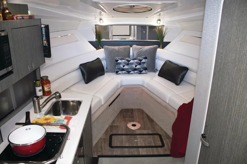 Slide: The Image of Manufacturer Provided Image: 2022 Monterey 295SS Super Sport interior with modern kitchen and cozy seating area. - 4