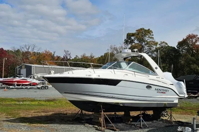 Slide: The Image of 2022 Monterey 295SS Super Sport boat on display outdoors. - 7