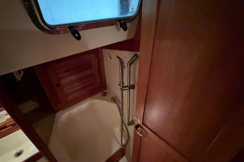 Slide: The Image of Compact bathroom with wooden accents in a 2000 Tartan 3500 yacht. - 15