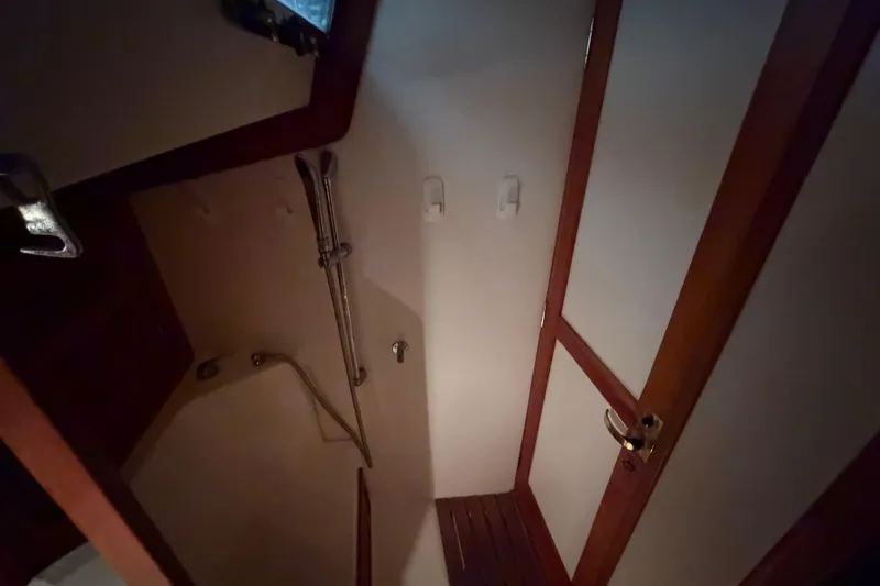 Slide: The Image of Compact bathroom with shower in a 2000 Tartan 3500 yacht. - 16