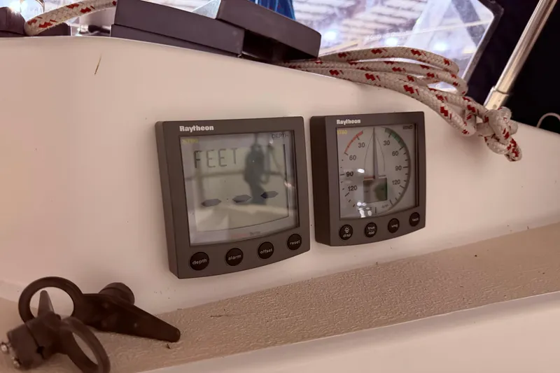 Slide: The Image of Raytheon marine instruments on a 2000 Tartan 3500 sailboat dashboard. - 24