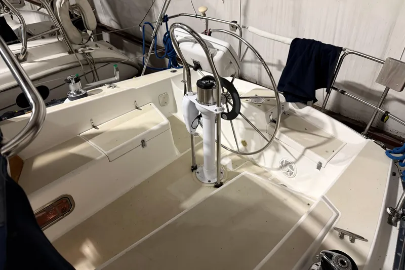 Slide: The Image of Cockpit of a 2000 Tartan 3500 sailboat with steering wheel and seating. - 28