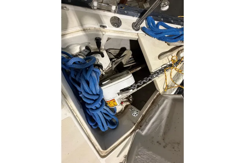 Slide: The Image of Anchor locker of a 2000 Tartan 3500 sailboat with blue rope and chain. - 31