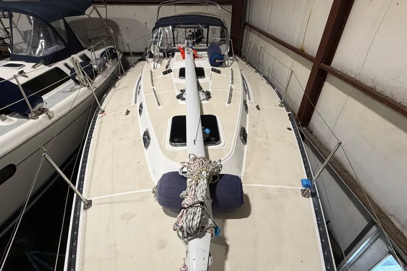 Slide: The Image of Tartan 3500 sailboat from 2000 in storage, showcasing deck and rigging. - 32
