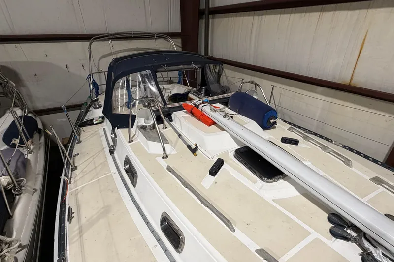 Slide: The Image of Tartan 3500 sailboat from 2000 in storage, featuring deck and cockpit view. - 33