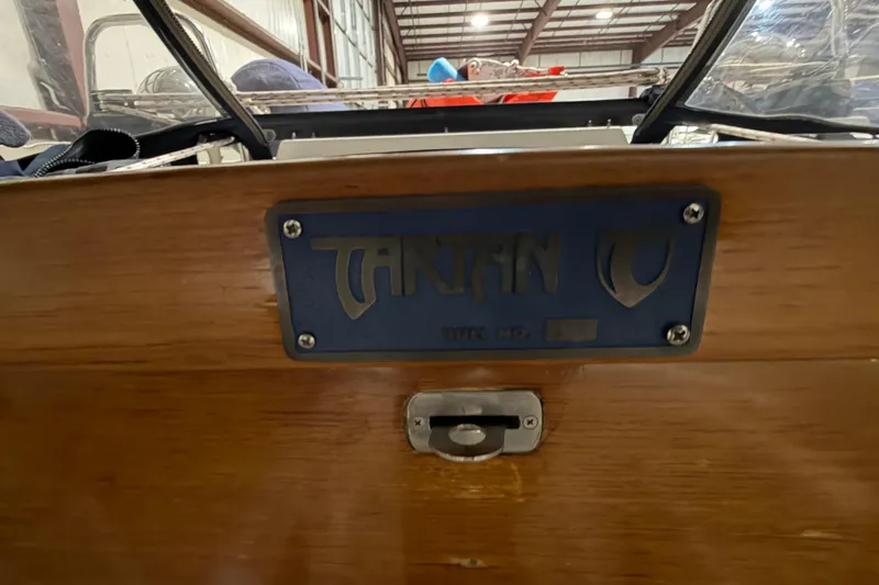 Slide: The Image of Tartan 3500 sailboat nameplate on wooden surface, indoor storage, year 2000 model. - 34