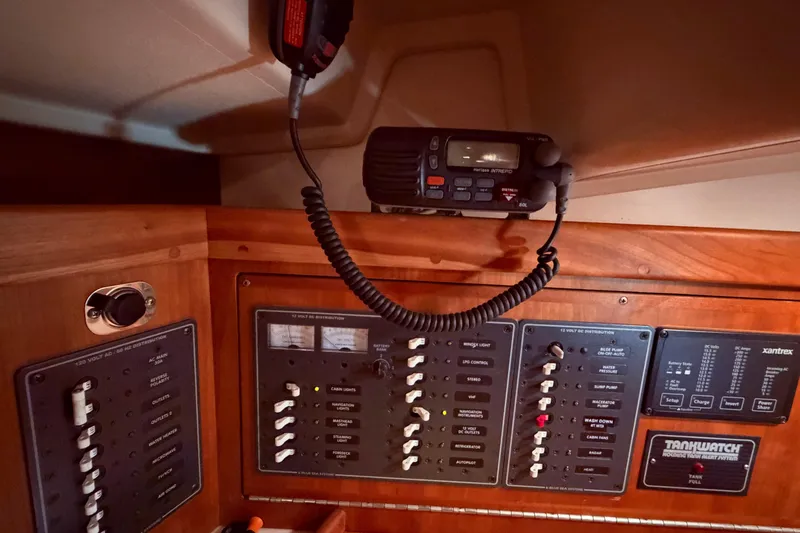 Slide: The Image of Control panel of a 2000 Tartan 3500 sailboat with radio and switches. - 5