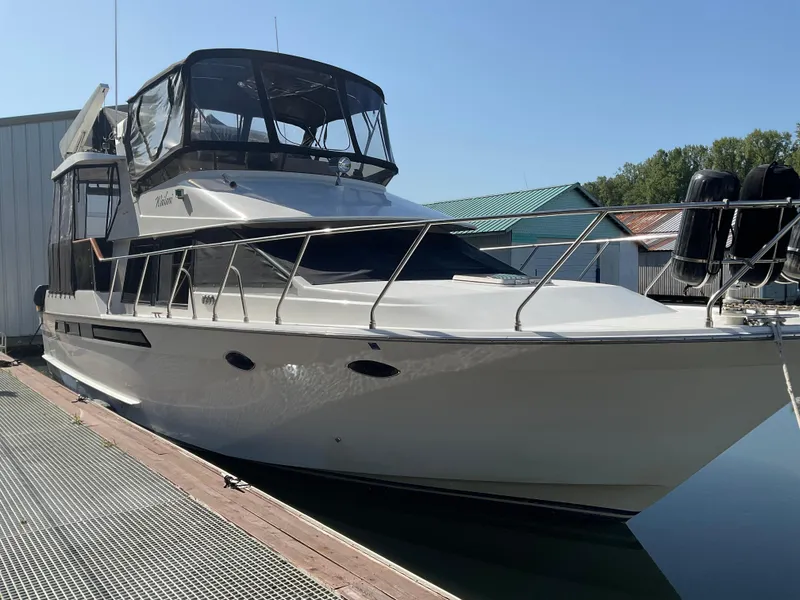 The Image of 1990 Ocean Alexander 440 Sundeck CPMY docked, side view. - 0
