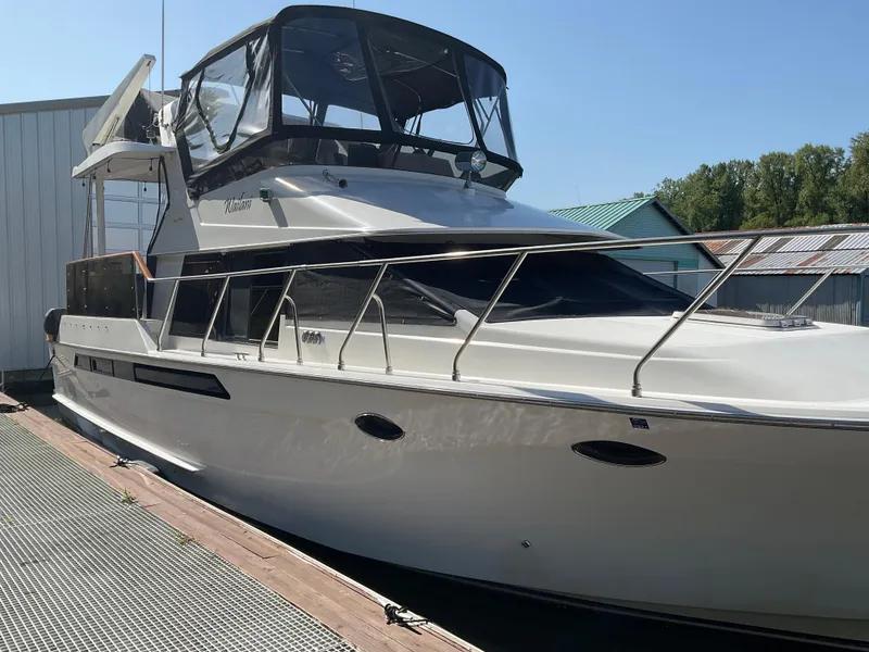 Slide: The Image of 1990 Ocean Alexander 440 Sundeck CPMY yacht at dock. - 1