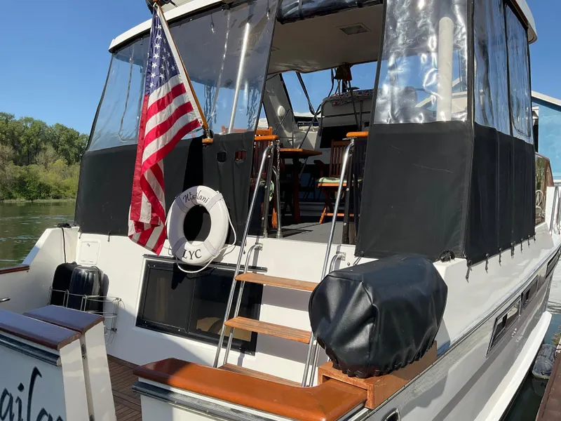 Slide: The Image of 1990 Ocean Alexander 440 Sundeck CPMY with American flag at stern. - 11