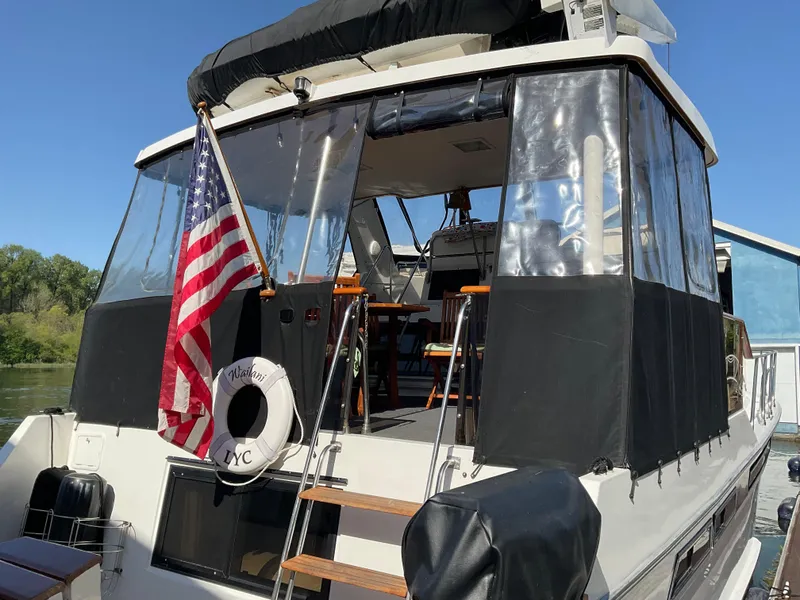 Slide: The Image of 1990 Ocean Alexander 440 Sundeck CPMY with American flag and lifebuoy. - 13