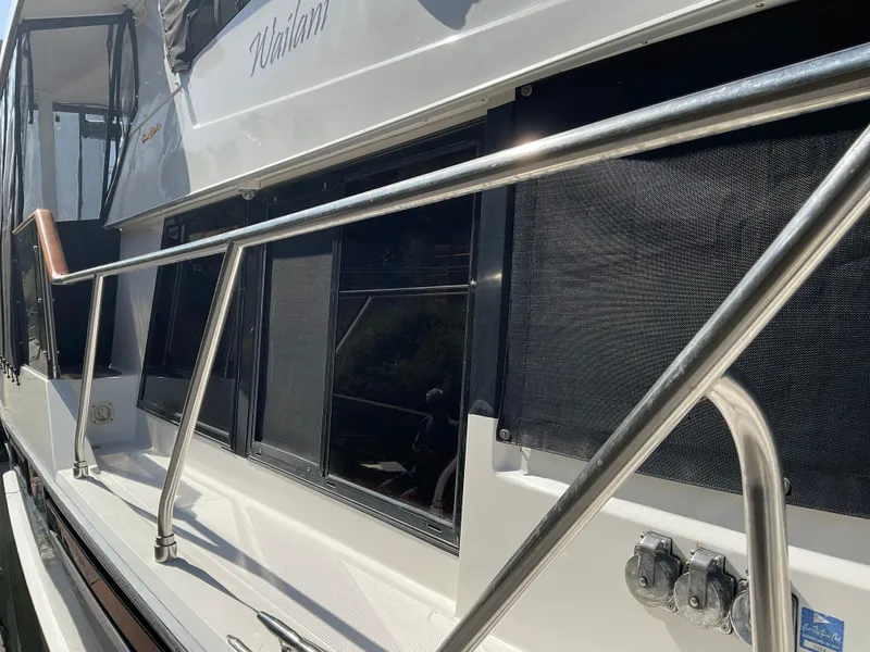 Slide: The Image of Ocean Alexander 440 Sundeck CPMY 1990, side view with railing. - 17