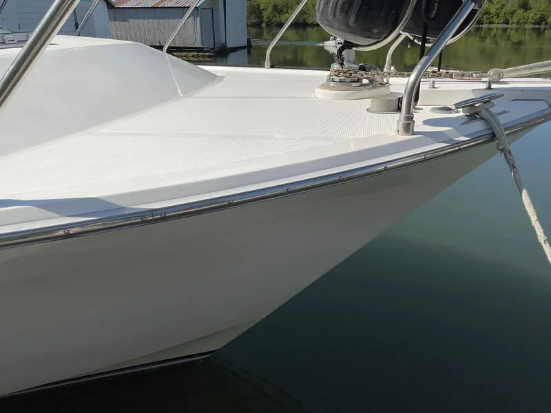 Slide: The Image of Bow of 1990 Ocean Alexander 440 Sundeck CPMY by the water. - 18