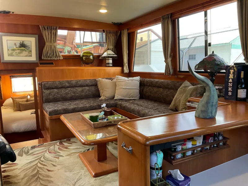 Slide: The Image of Interior of 1990 Ocean Alexander 440 Sundeck CPMY, cozy seating area. - 26