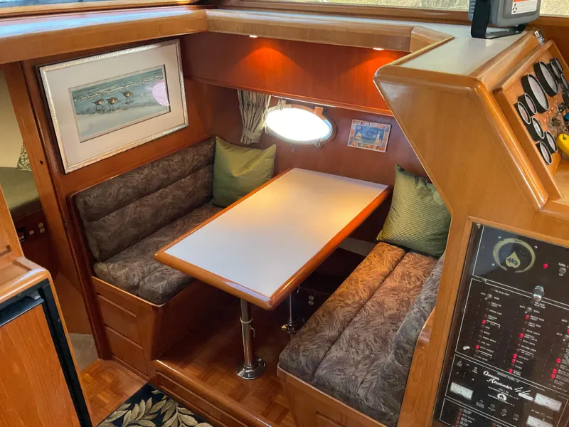 Slide: The Image of Interior of 1990 Ocean Alexander 440 Sundeck CPMY with cozy seating area. - 31