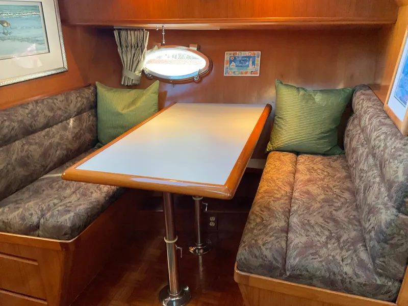 Slide: The Image of Interior of 1990 Ocean Alexander 440 Sundeck CPMY with cozy seating area. - 32