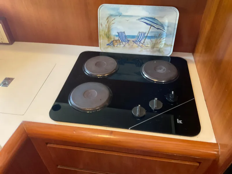 Slide: The Image of Kitchen area of Ocean Alexander 440 Sundeck CPMY 1990 with stove. - 34