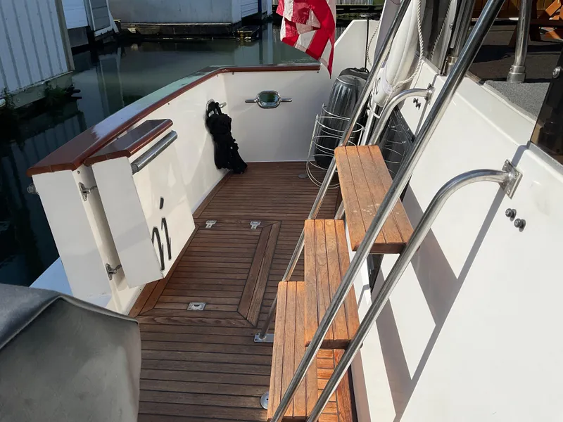 Slide: The Image of 1990 Ocean Alexander 440 Sundeck CPMY with wooden deck and stairs. - 7