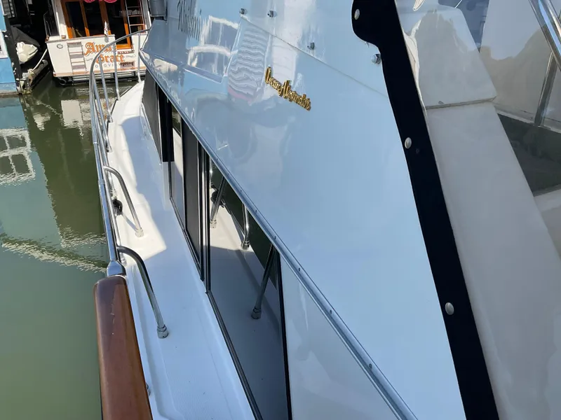 Slide: The Image of 1990 Ocean Alexander 440 Sundeck CPMY docked, side view. - 9