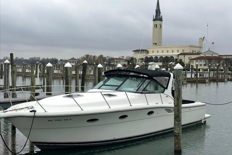 The Image of 2000 Tiara Yachts 3500 Open docked at a marina with a historic building in the background. - 0
