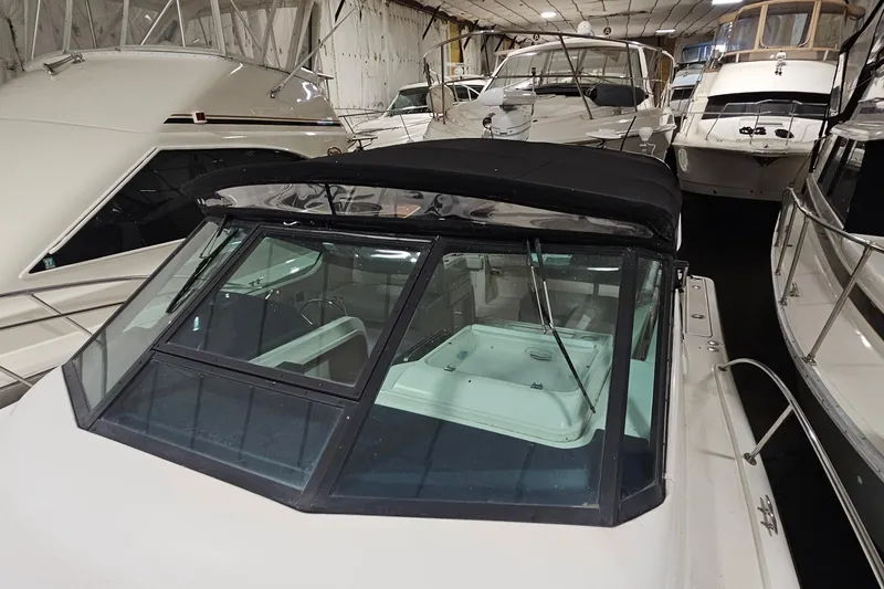 Slide: The Image of 2000 Tiara Yachts 3500 Open in storage, surrounded by other boats. - 16