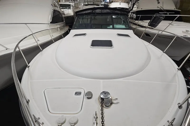 Slide: The Image of 2000 Tiara Yachts 3500 Open boat docked among other vessels in a marina. - 17