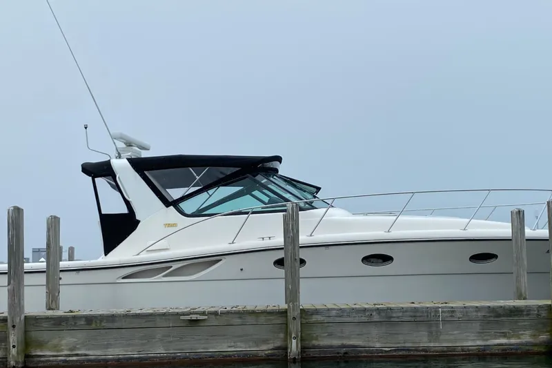 Slide: The Image of 2000 Tiara Yachts 3500 Open docked, showcasing sleek design and modern features. - 19