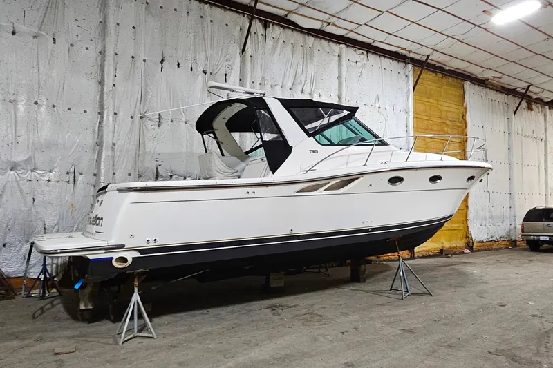 Slide: The Image of 2000 Tiara Yachts 3500 Open boat in indoor storage on stands. - 22