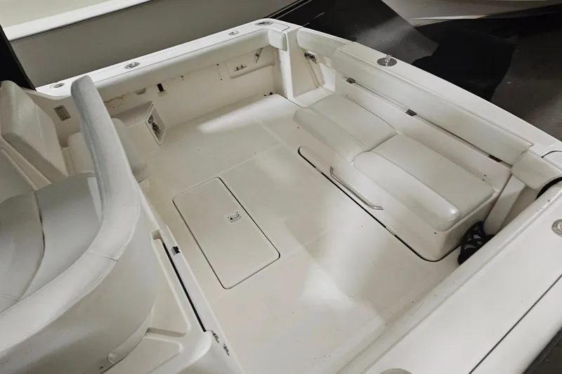 Slide: The Image of 2000 Tiara Yachts 3500 Open interior with white seating and storage compartments. - 6