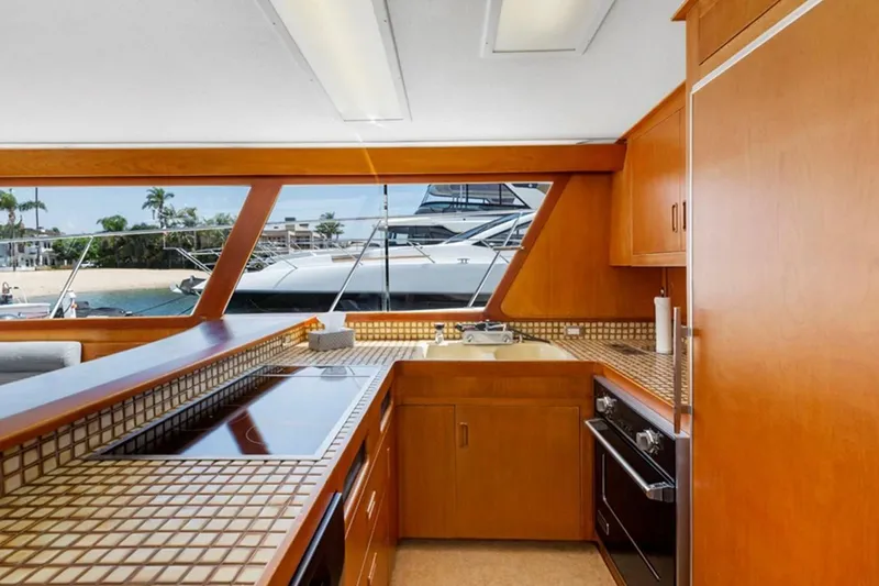 Slide: The Image of Interior of 1983 Elliott Yacht Fisher kitchen with wooden cabinetry and modern appliances. - 11