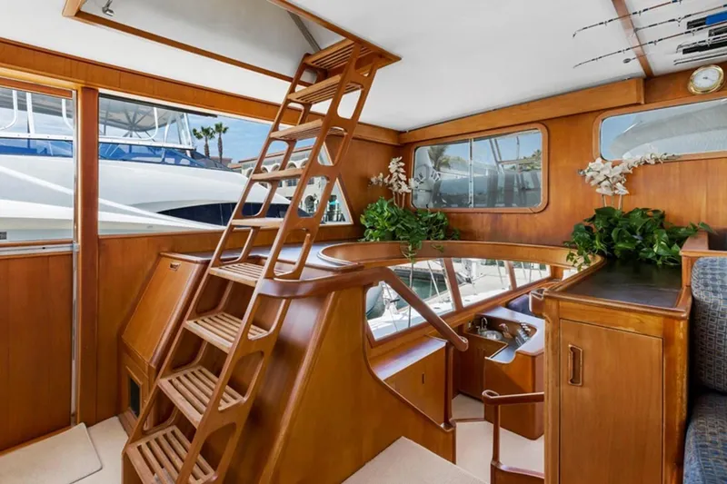 Slide: The Image of Interior of 1983 Elliott Yacht Fisher with wooden decor and plants. - 4