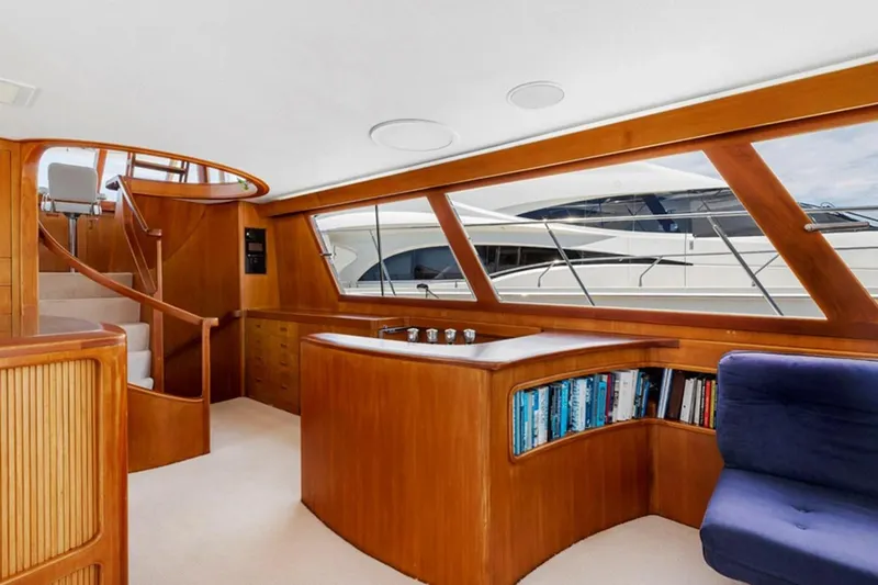 Slide: The Image of Interior of 1983 Elliott Yacht Fisher with wooden finishes and built-in bookshelf. - 9