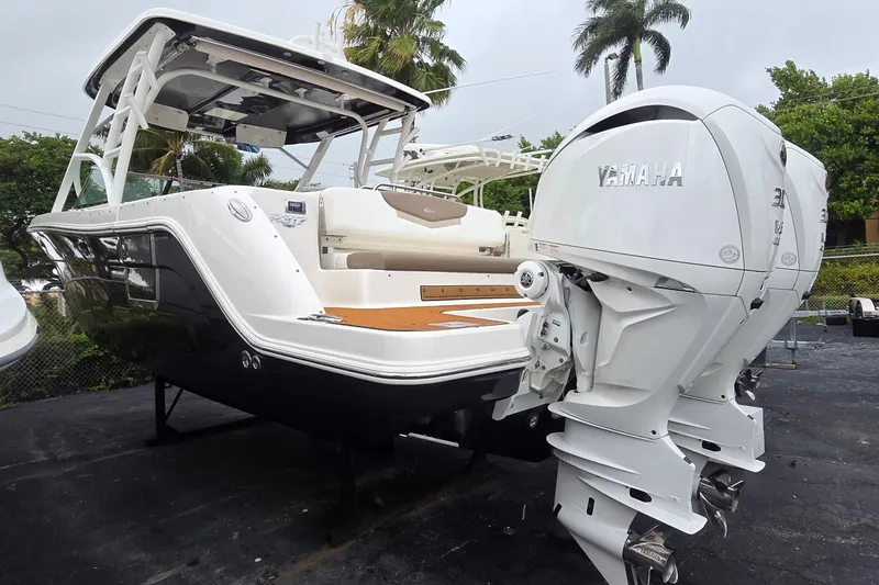 The Image of 2023 Robalo R317 Dual Console boat with Yamaha engines, parked outdoors. - 0