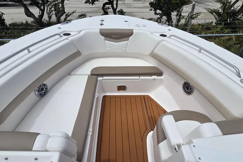 Slide: The Image of 2023 Robalo R317 Dual Console boat with teak deck and cushioned seating. - 13